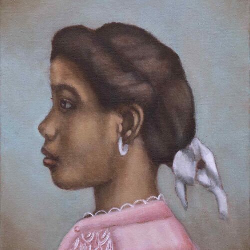 Teenage African American girl profile, wearing pink blouse and white ribbon in her hair.